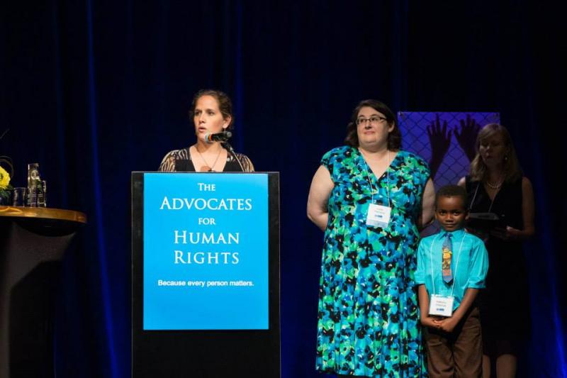 Laura receives an award for her pro-bono asylum work (2014).